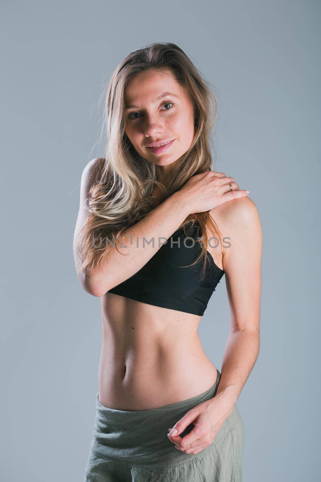 Portrait of young slim fitness woman. Sport and healthy lifestyle concept