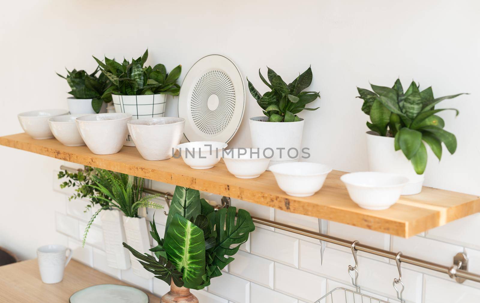 Home interior of a trendy, stylish, bright Scandinavian-style kitchen with open shelves. Loft interior.