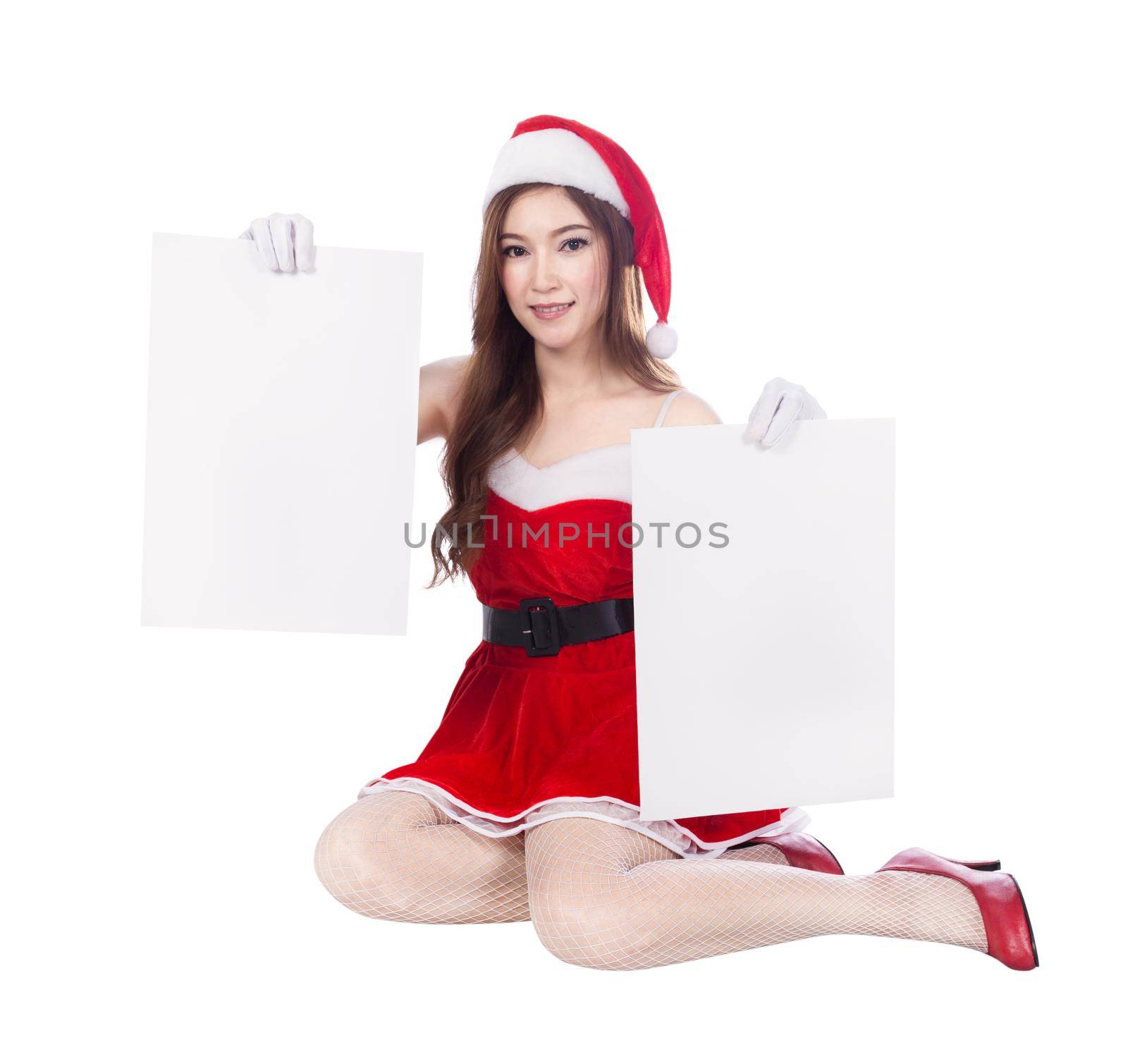 beautiful sexy woman wearing santa claus clothes with blank sign isolated on white background