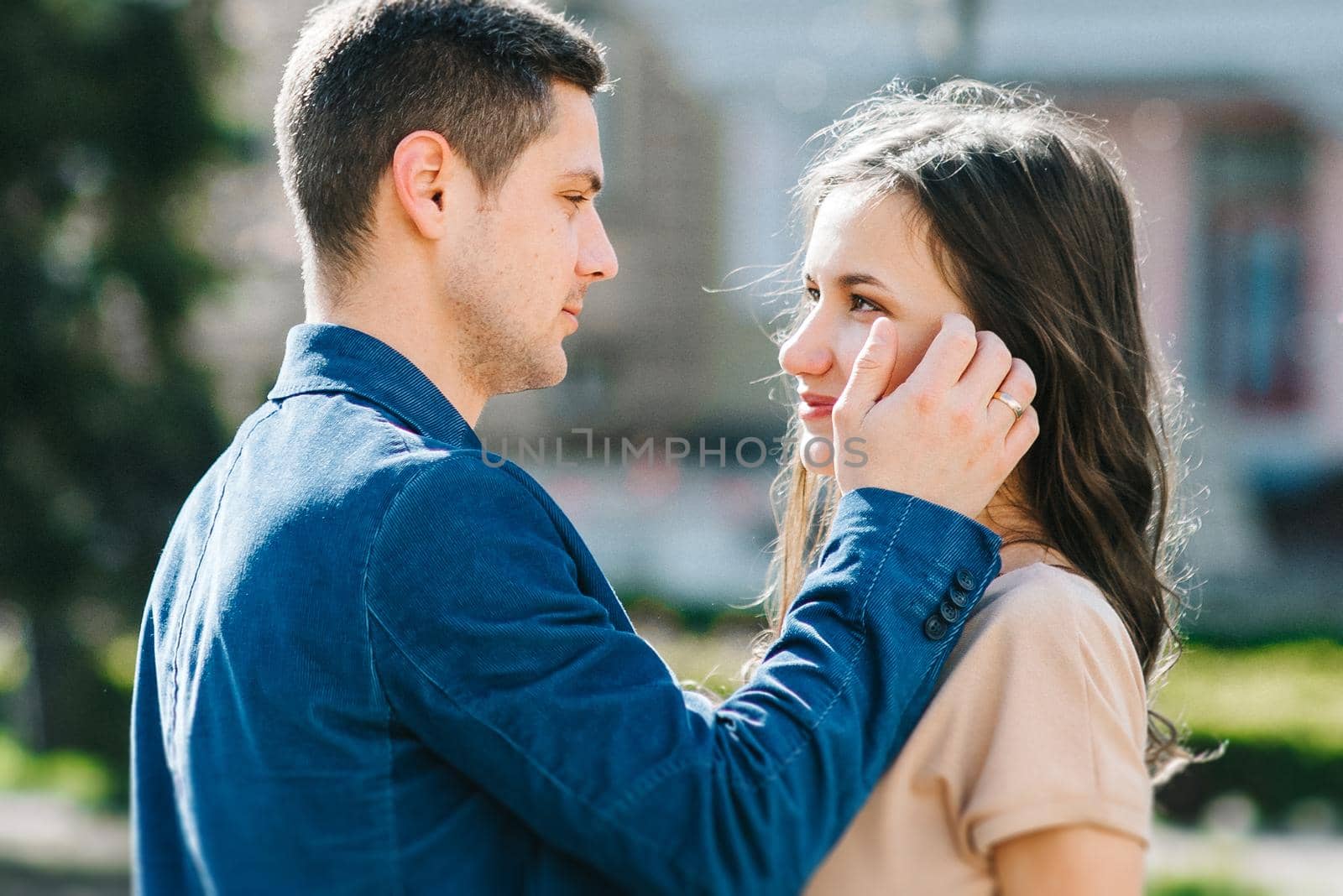 guy and a girl happily walk in the morning on the empty streets of old Europe