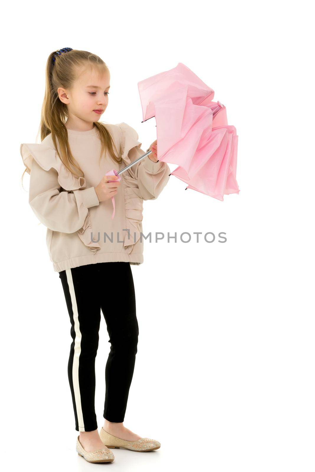 Beautiful little girl with umbrella. Concept of weather, climate change. Isolated on white background