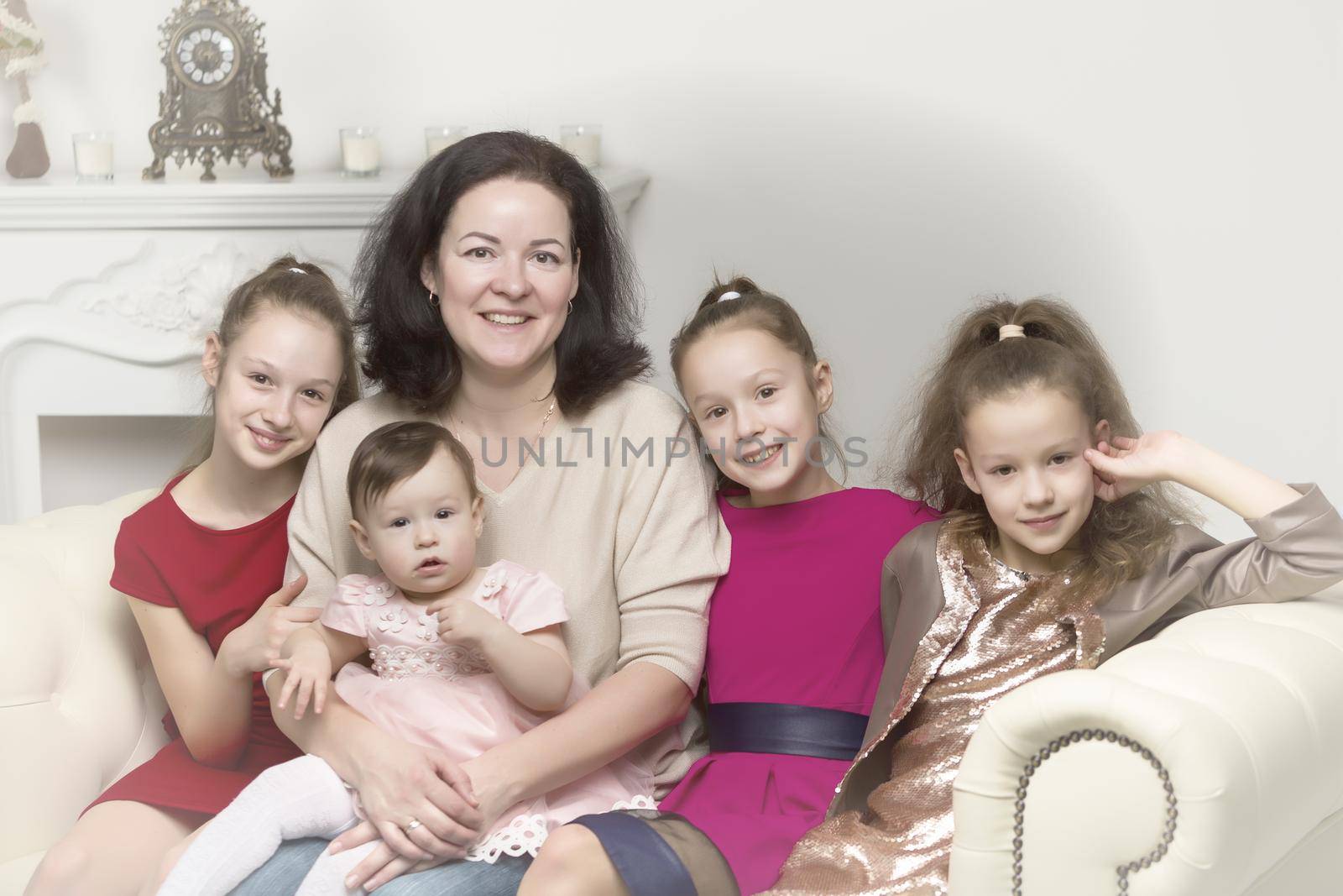 Studio Portrait of Happy Family of Mother and Three Daughters by kolesnikov_studio