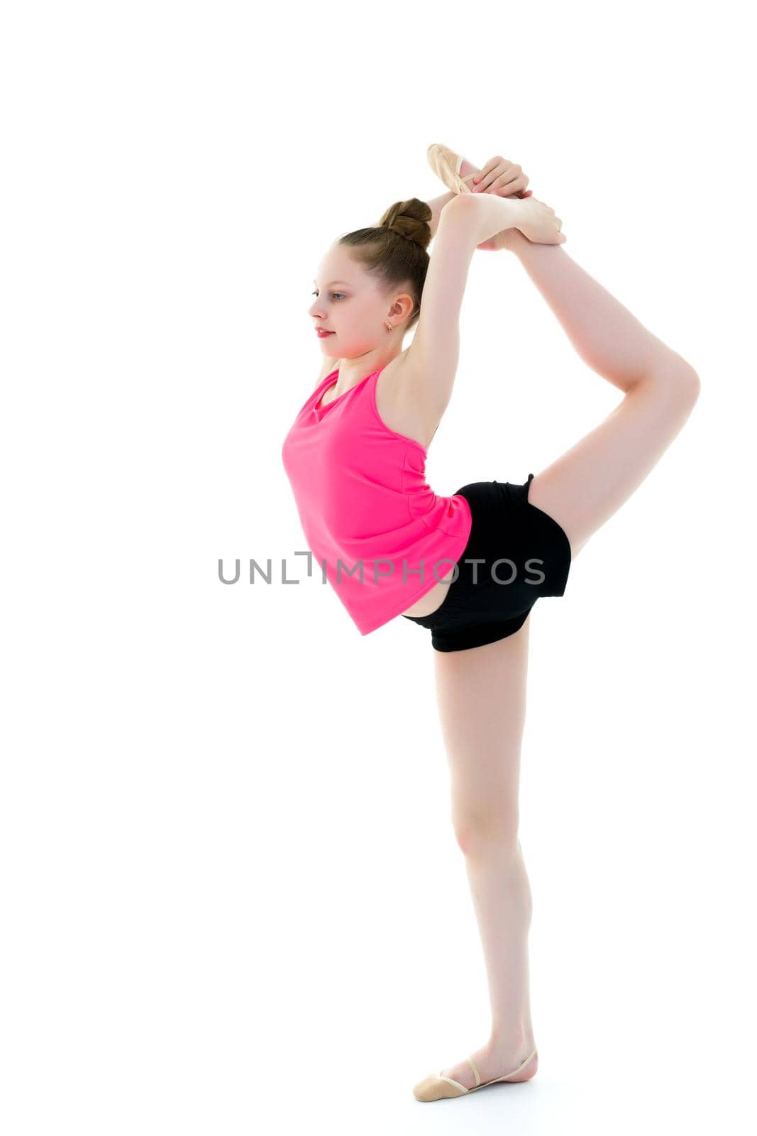 The gymnast balances on one leg. by kolesnikov_studio