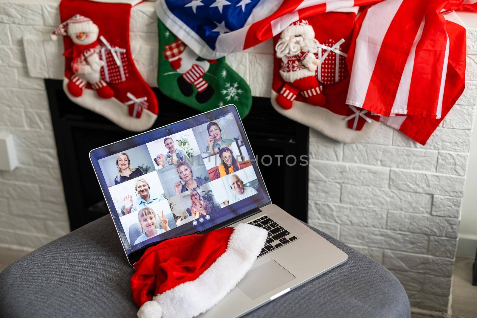 Virtual Christmas tree meeting team teleworking. Family video call remote conference. Laptop webcam screen view. Team meet working from their home offices. Happy hour party online woman team diversity by Andelov13