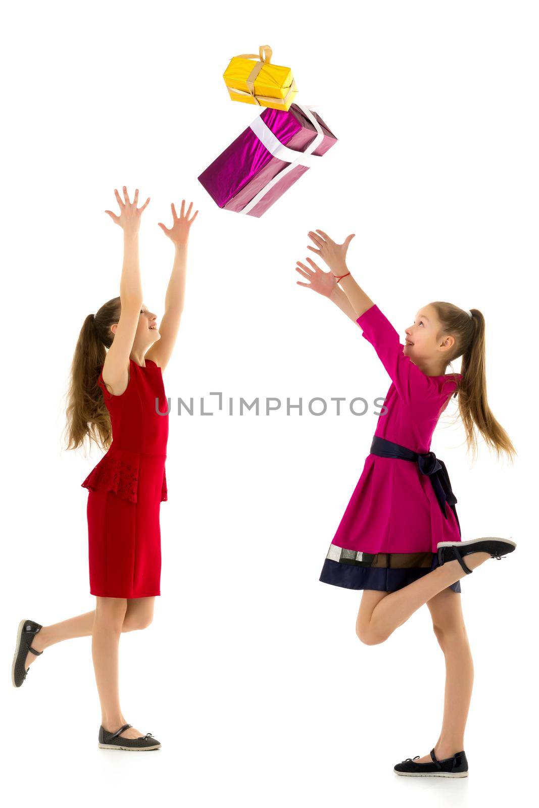 Happy little girls rejoices at the gift. Holidays, new year concept.