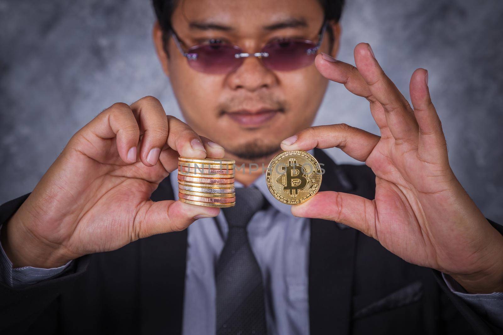 bitcoin in hand of business man with suit
