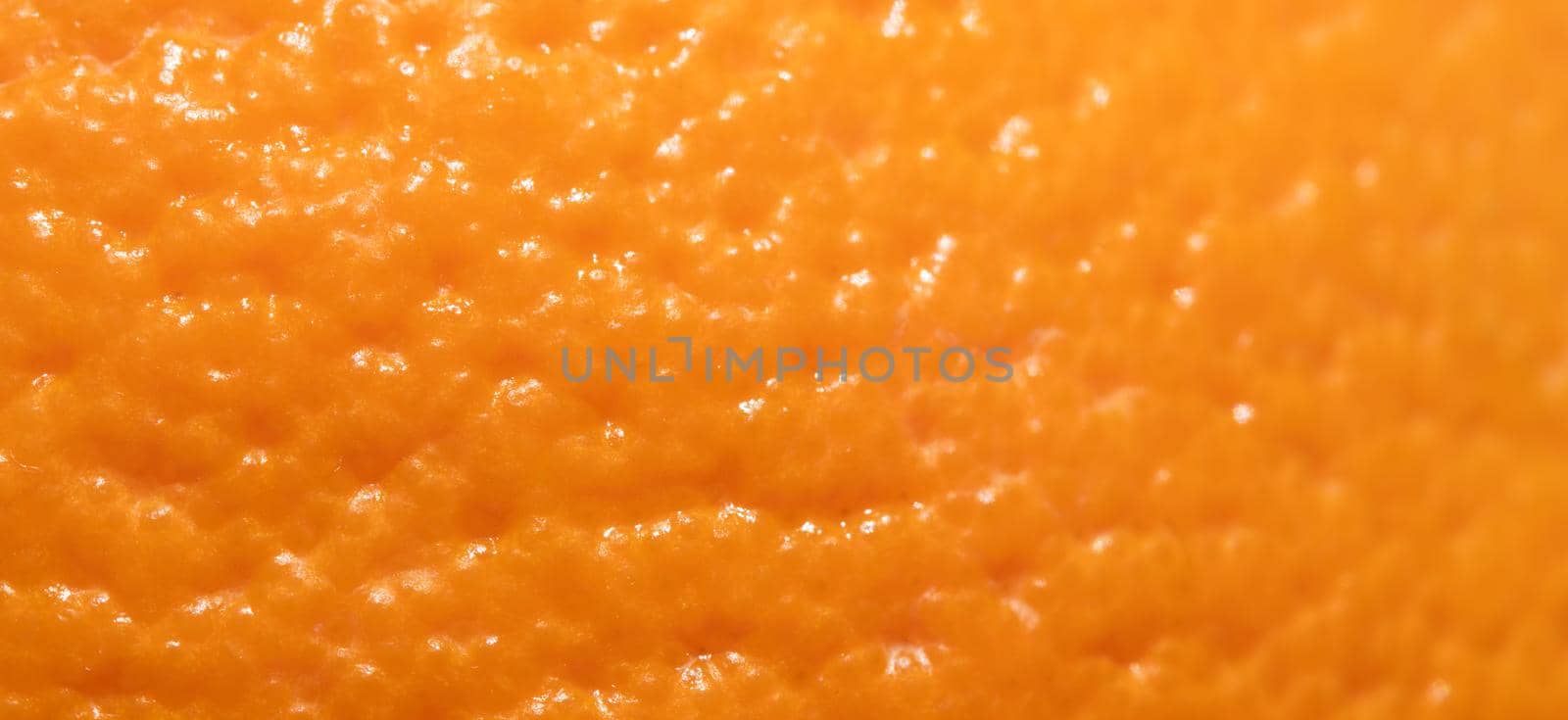 Ripe orange peel background. Close up view by Olayola