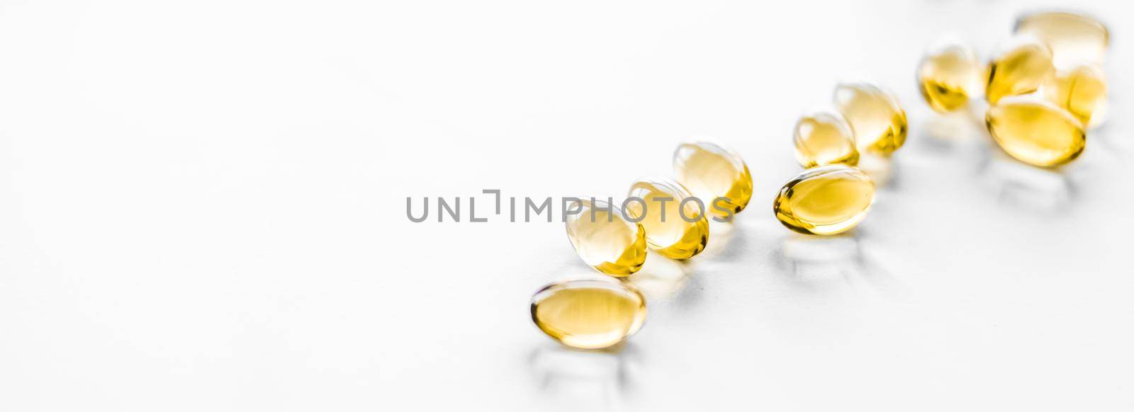 Pharmaceutical, branding and science concept - Vitamin D and golden Omega 3 pills for healthy diet nutrition, fish oil food supplement pill capsules, healthcare and medicine as pharmacy background