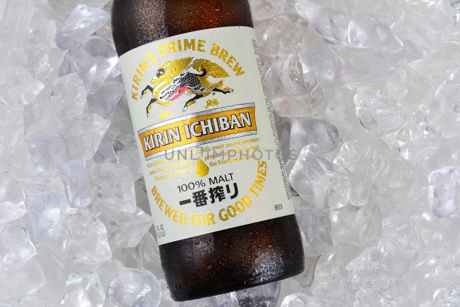 IRVINE, CA - JANUARY 11, 2015: A bottle of Kirin Ichiban closeup on a bed of ice. Kirin is a popular brand of Japanese beer imported into the United States.