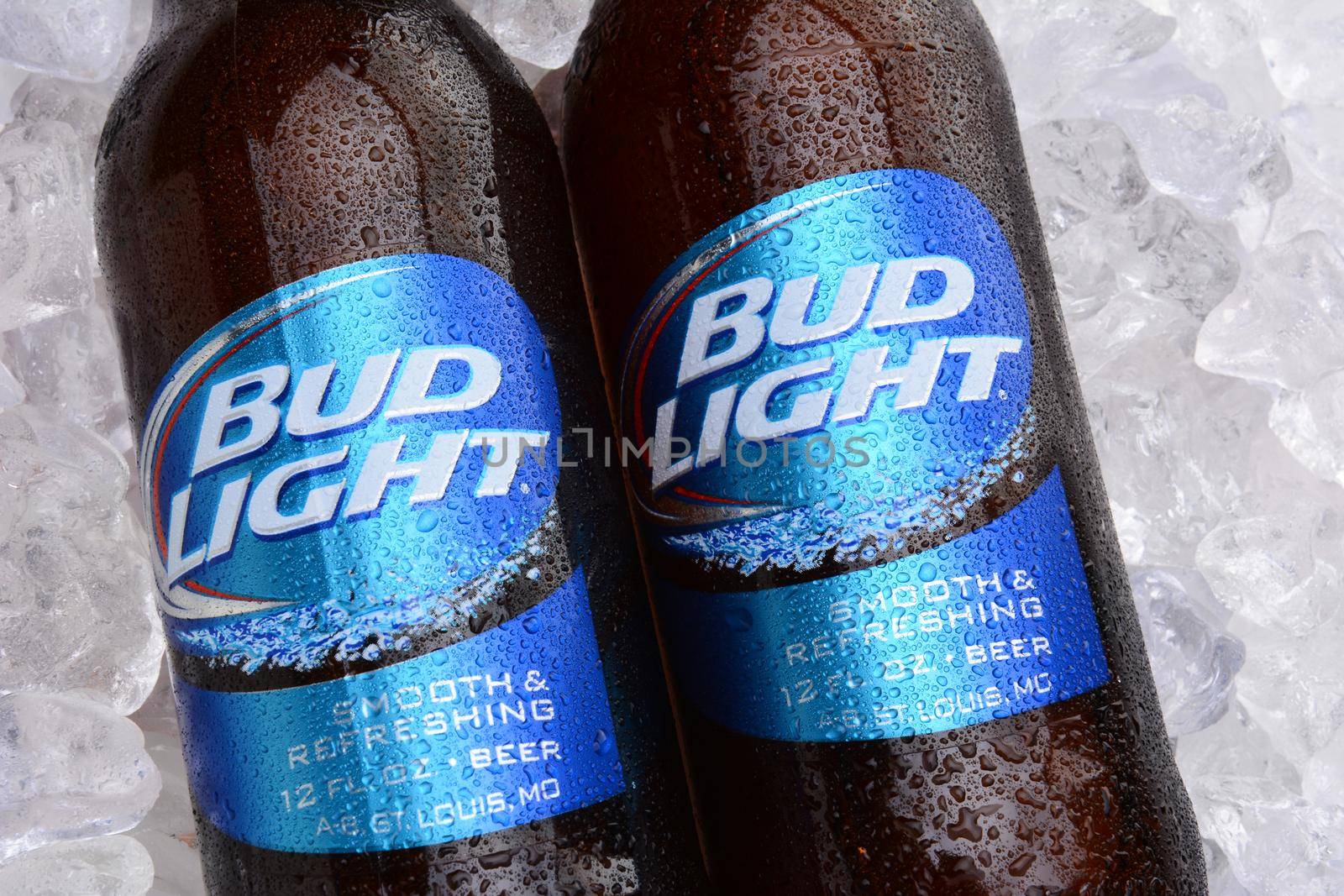 IRVINE, CA - MAY 27, 2014: Two bottles of Bud Light on a bed of ice. From Anheuser-Busch InBev, Bud Light is the top selling domestic beer in the United States.