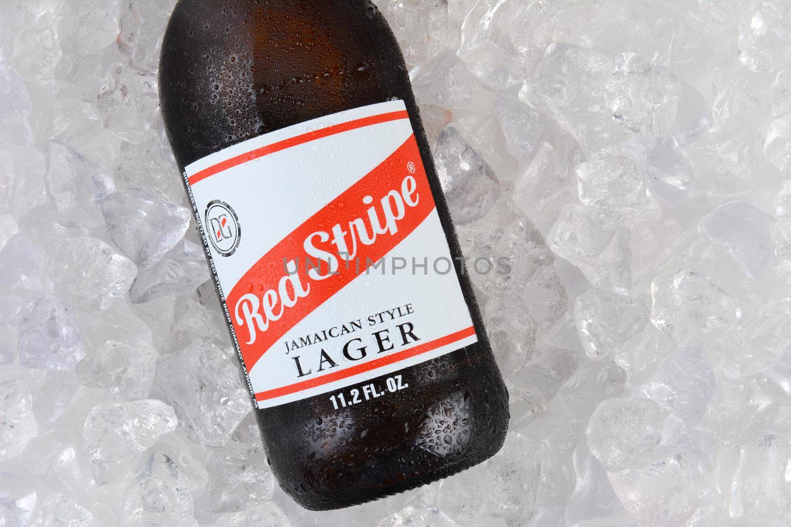 Red Stripe Lager on Ice Closeup by sCukrov