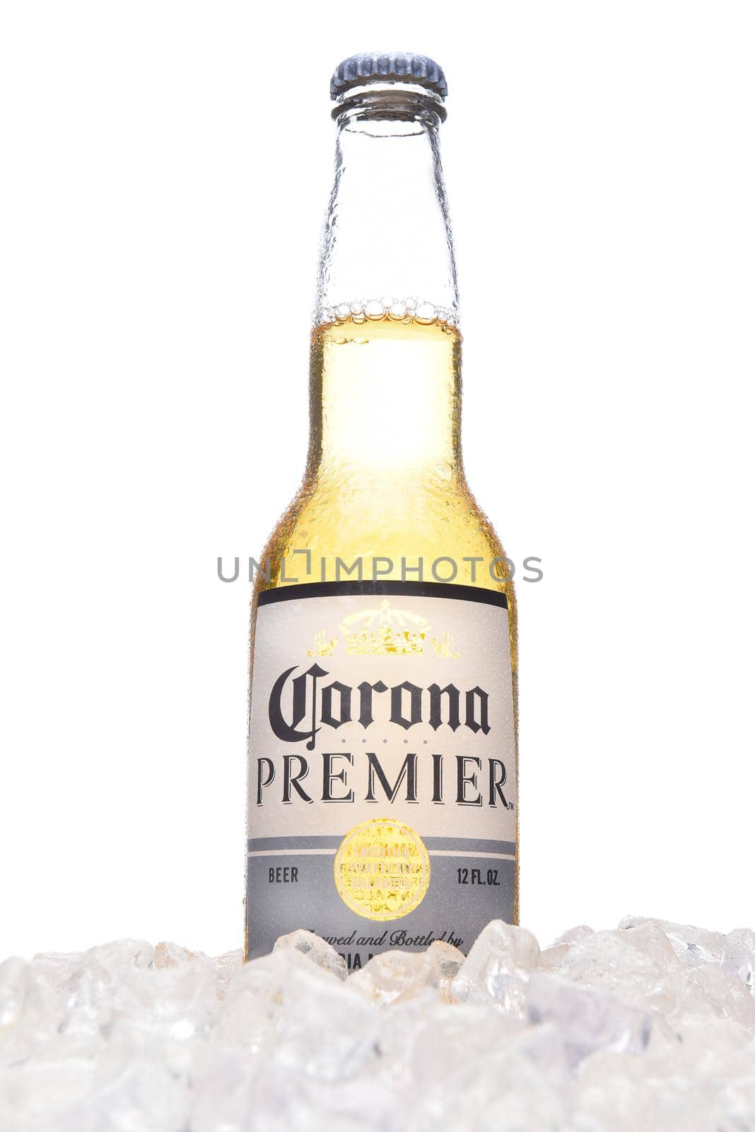 IRVINE, CALIFORNIA - MARCH 21, 2018:  A bottle of Corona Premier in ice. Corona Premier is premium light beer with 2.6 grams of carbs and 90 calories.
