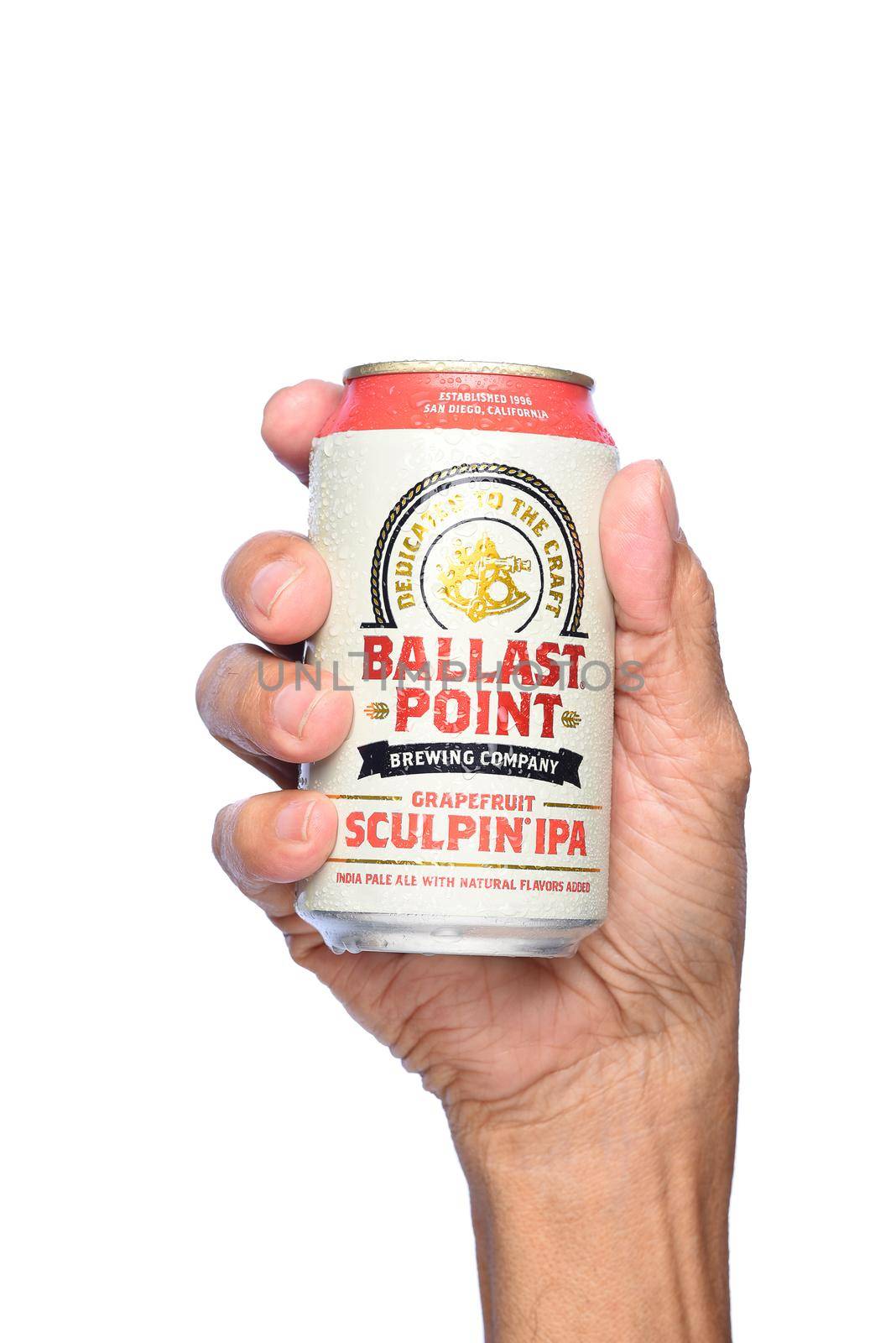 IRVINE, CALIFORNIA - APRIL 26, 2019: Closeup of a hand holding a cold can of Ballast Point Grapefruit Sculpin IPA, with condensation.