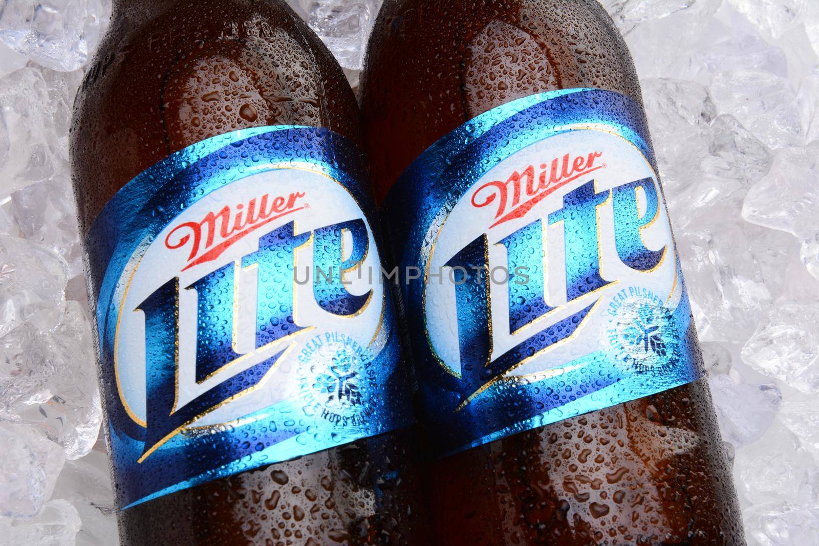 IRVINE, CA - MAY 27, 2014: Two bottles of Miller Light on a bed of ice. Introduced in 1975 Miller Lite was one of the first Reduced Calorie beers to be successful in the American marketplace.