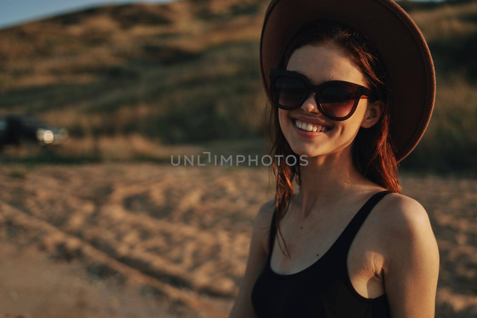woman in sunglasses near car travel summer vacation landscape. High quality photo