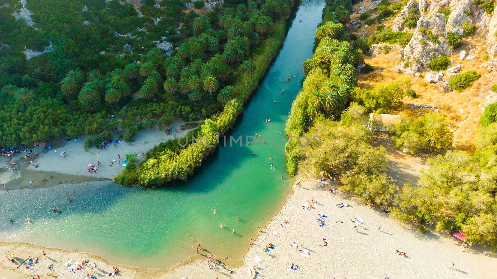 Panorama of Preveli beach at Libyan sea, river and palm forest, southern Crete , Greece