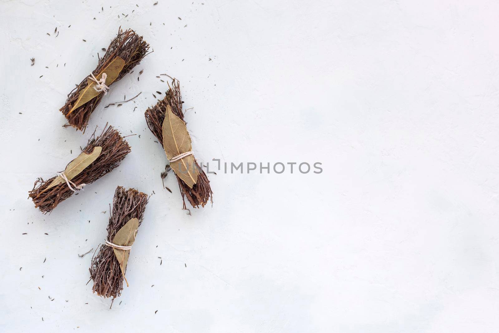 dry bouquet garni on the white background, copyspace