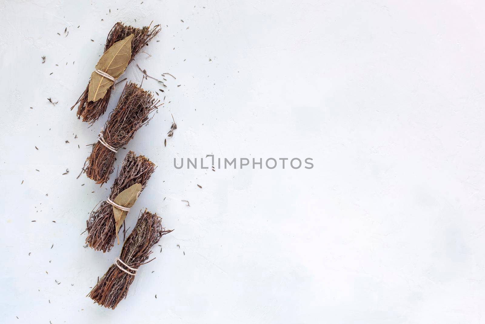 dry bouquet garni on the white background, copyspace