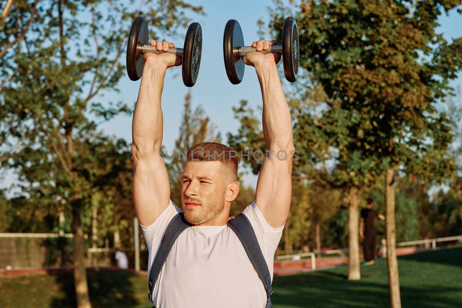 sportive man workout in the park morning motivation by Vichizh