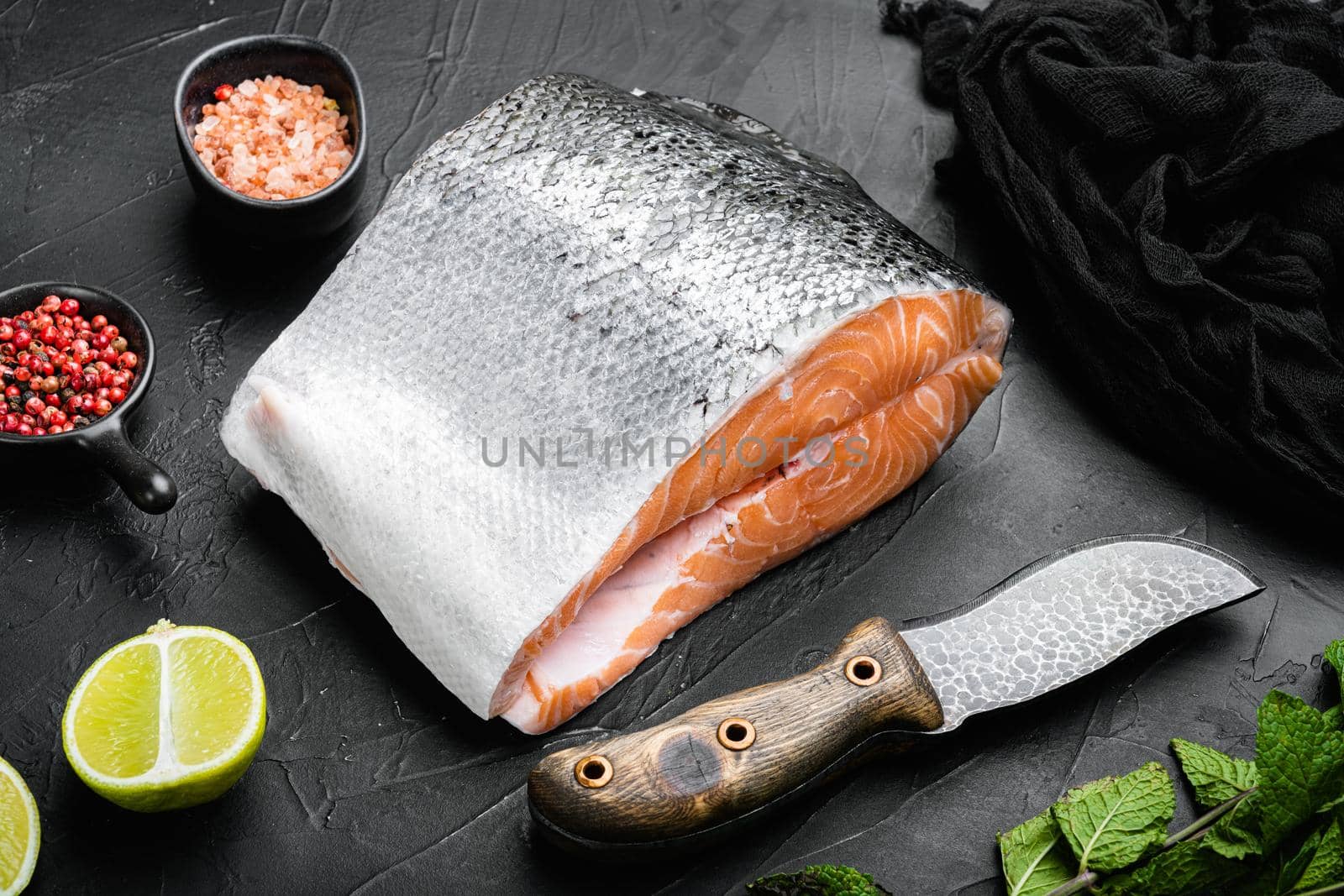 Wild Alaskan Sockeye or Coho Salmon fillet set, on black dark stone table background