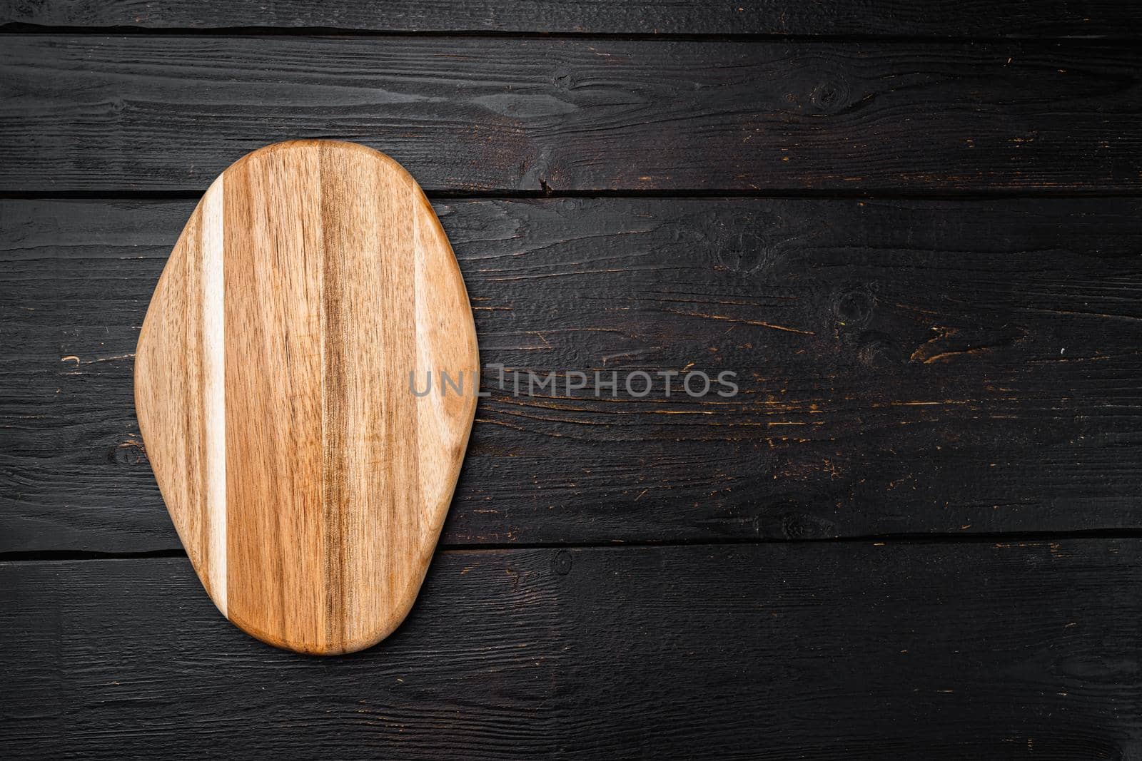Pine wooden cutting board set, on black wooden table background, top view flat lay , with copy space for text or your product