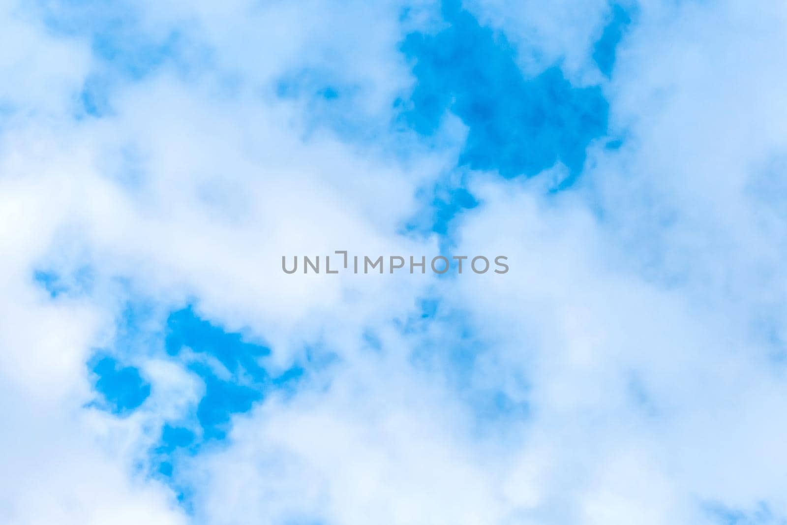 White soft clouds on blue sky texture background.