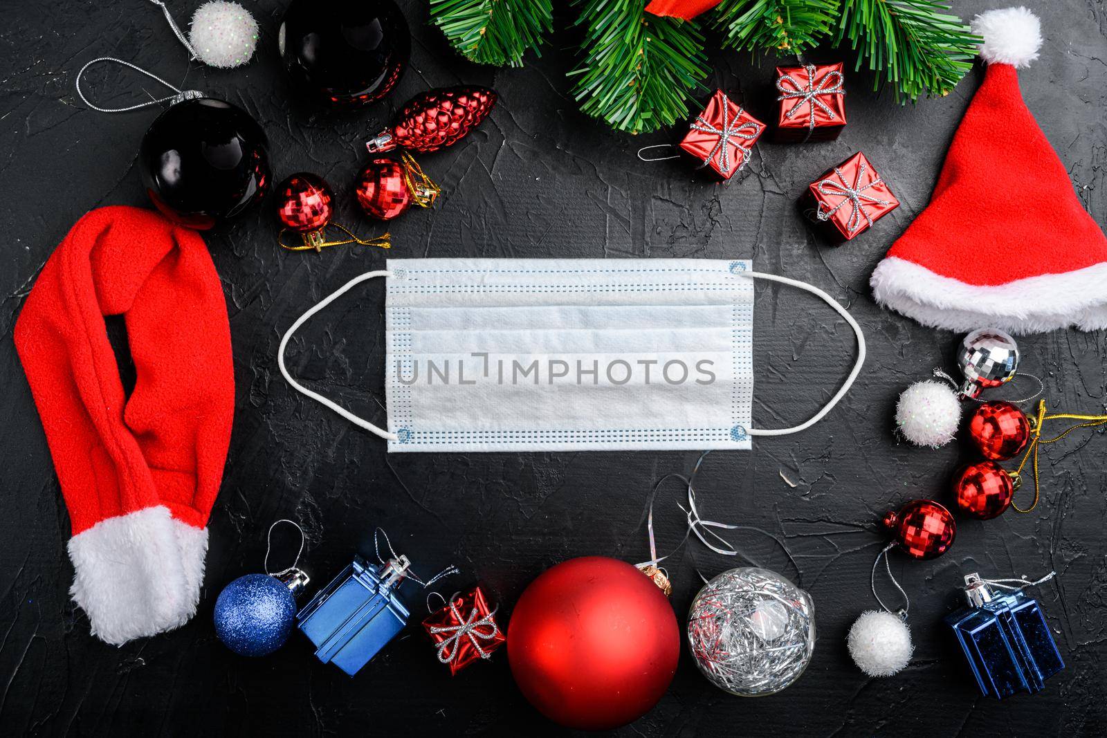 Coronavirus and Christmas celebration concept set, on black dark stone table background, top view flat lay