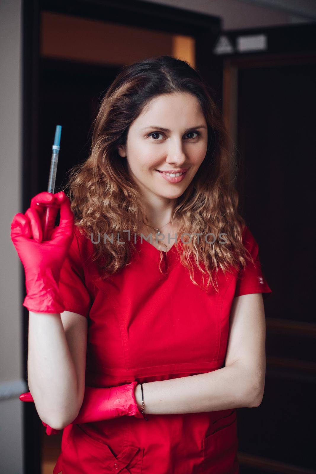 cheerful woman cosmetologist preparing for lip augmentation procedure