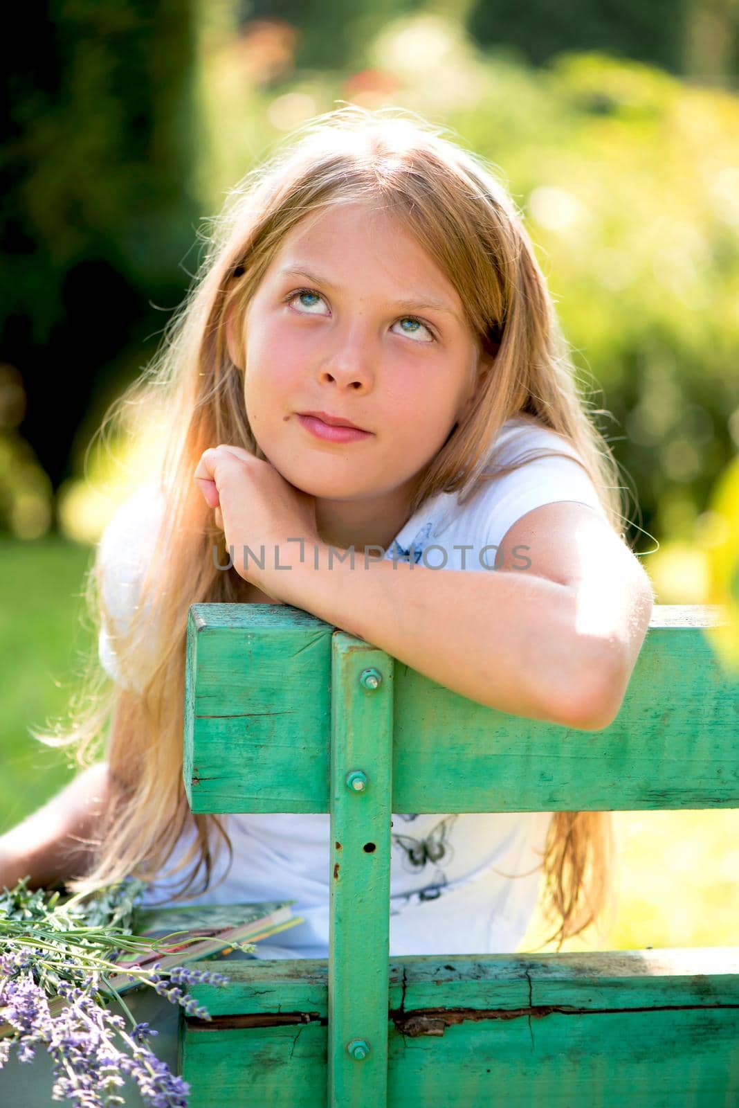 Portrait of little girl with lavender flower bouquet