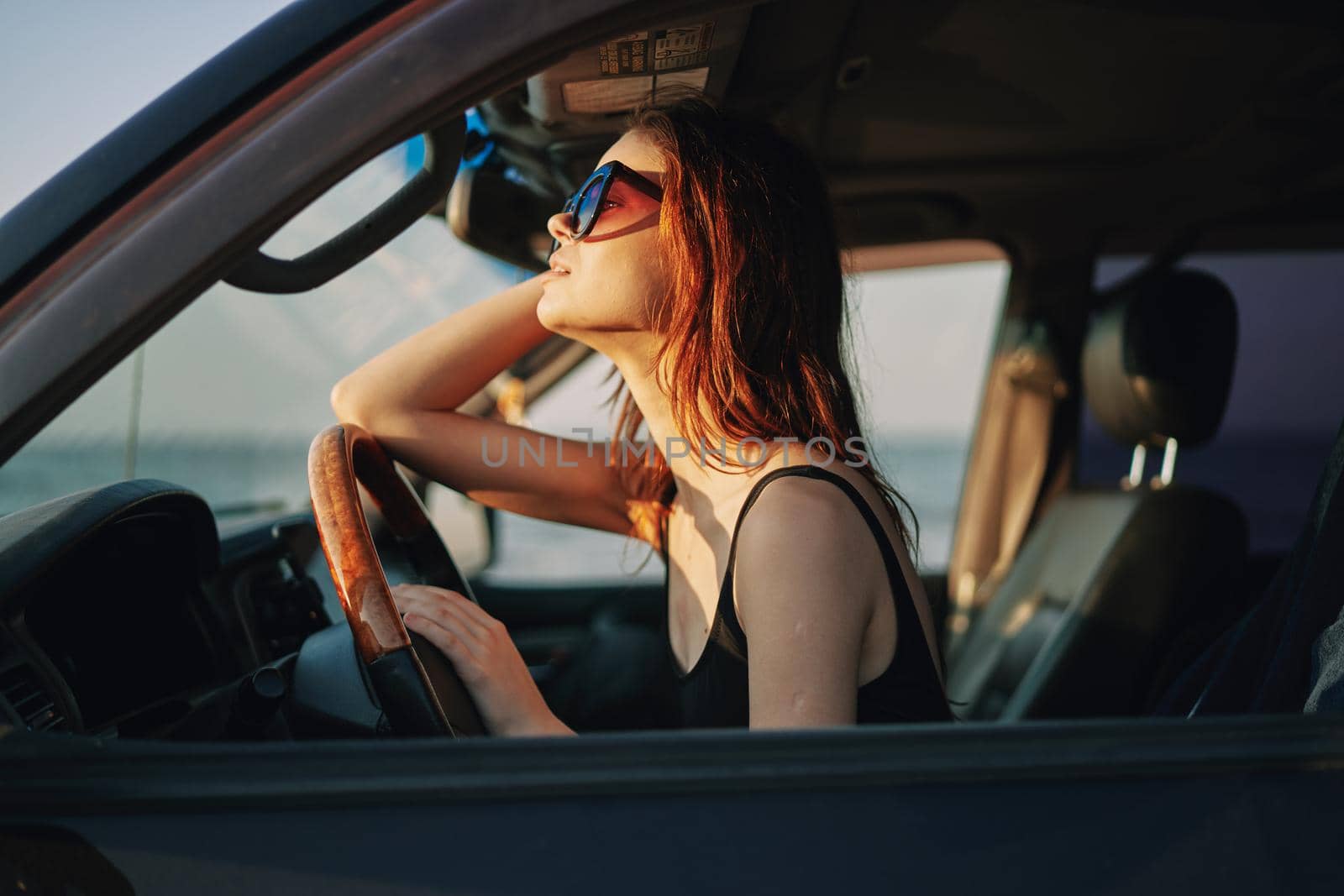 woman driving in car trip posing fashion travel. High quality photo