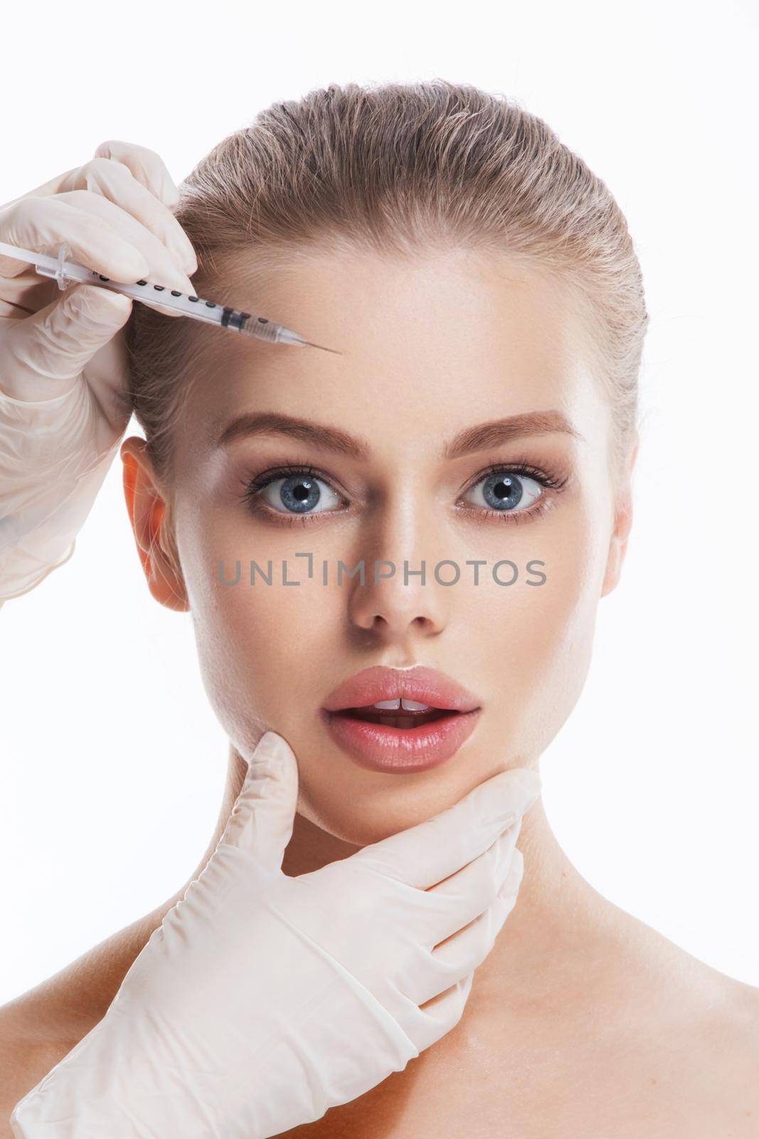Cosmetic injection to the pretty woman face beauty shot, isolated on white background