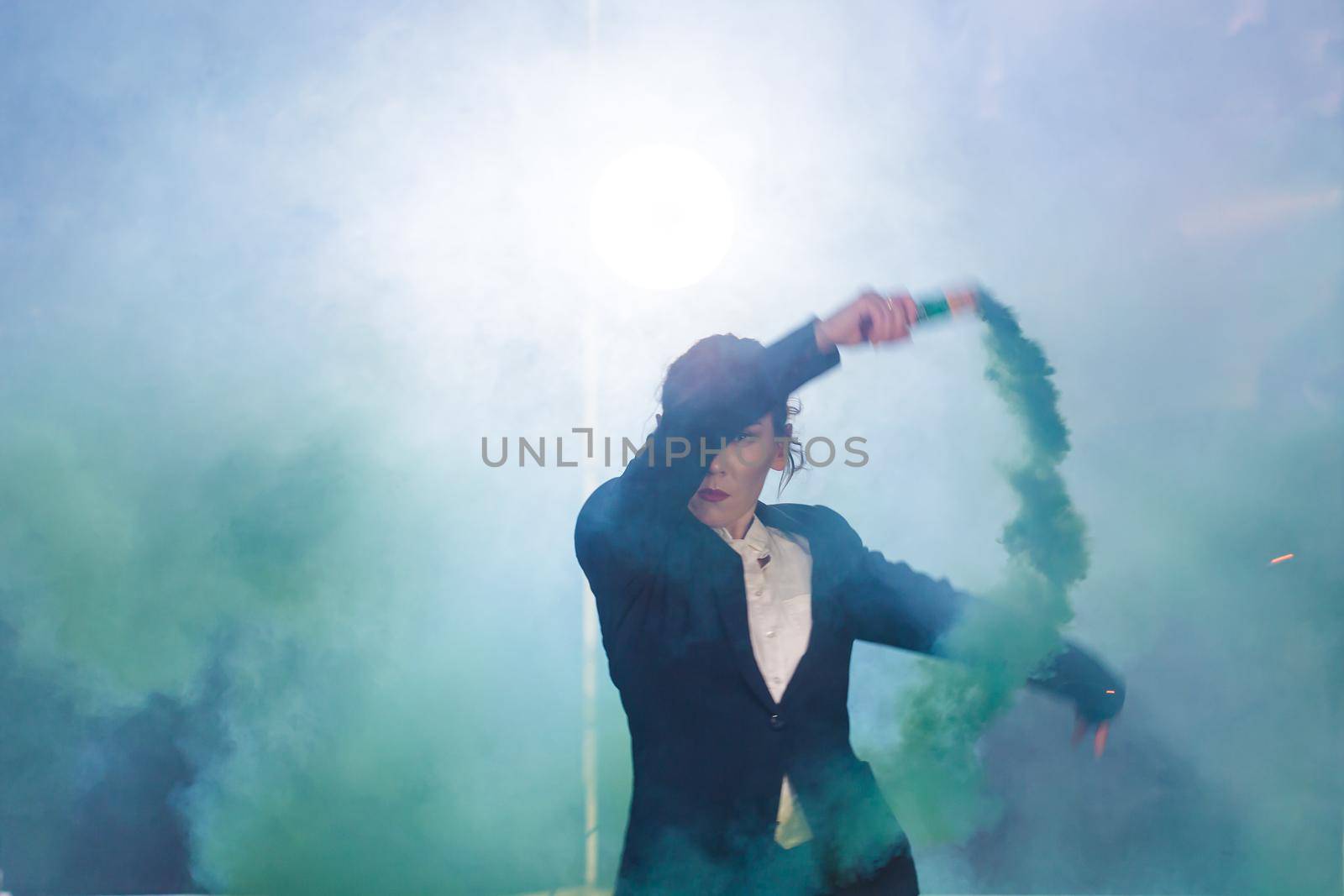 Pasadoble, latin solo dance and contemporary dance - Young beautiful female dancing into smoke cloud.