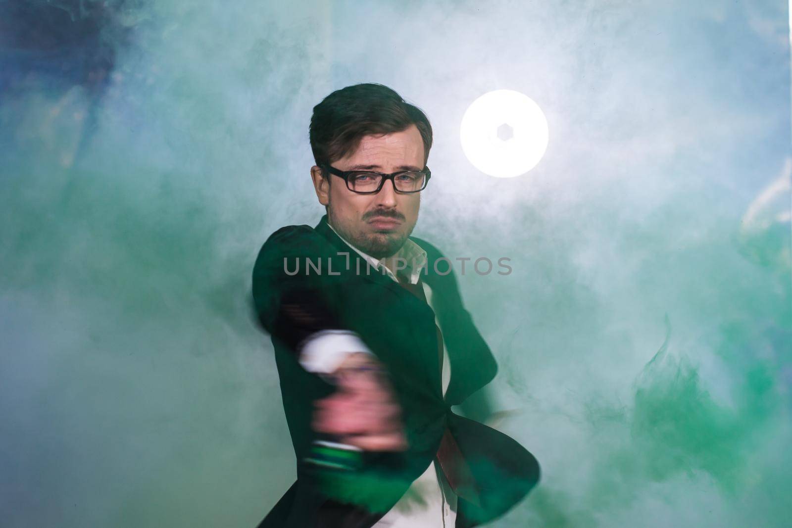 Pasadoble, latin solo dance and contemporary dance - Handsome male dancing into smoke cloud