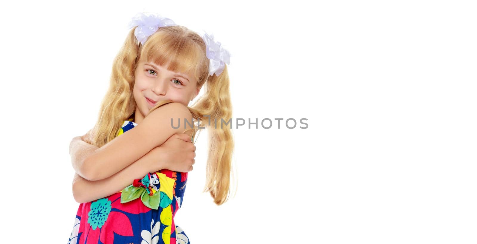 Beautiful little girl close-up. The concept of beauty and fashion, happy childhood. Isolated on white background.