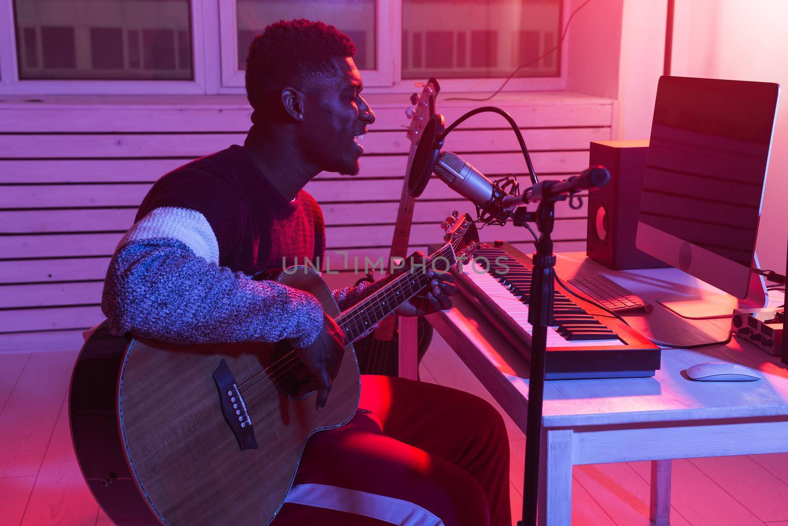 Musician and making music concept - Male sound producer working in recording studio