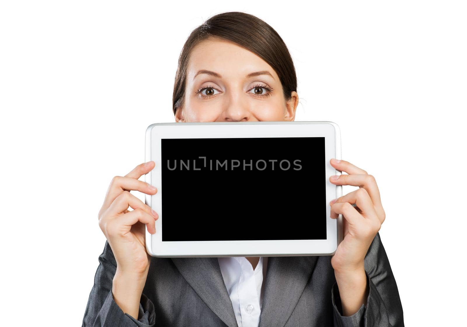 Businesswoman holding tablet computer with blank screen. Happy woman in business suit show tablet PC near her face. Corporate businessperson isolated on white background. Digital technology layout