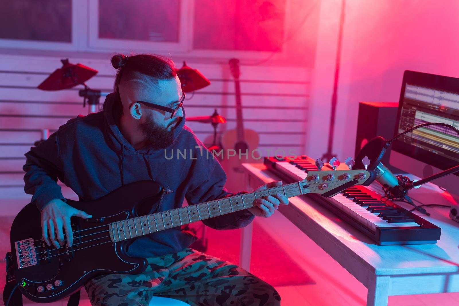 Musician and making music concept - Male sound producer working in recording studio