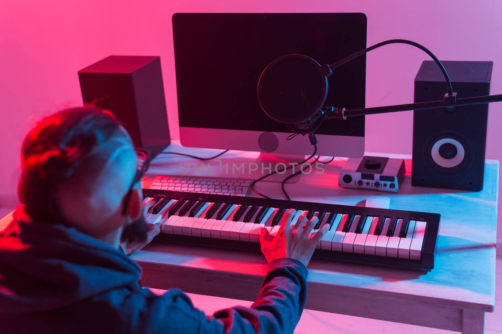 Musician and making music concept - Male sound producer working in recording studio