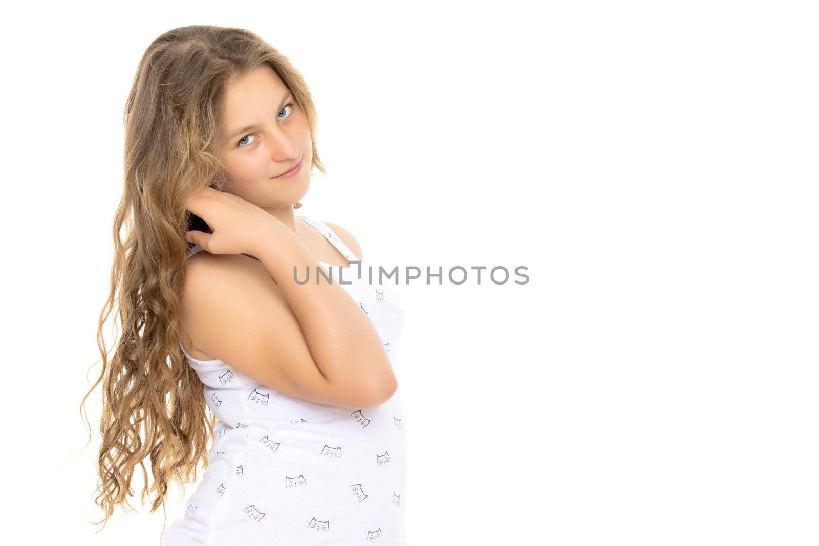 A schoolgirl girl with beautiful long hair. Isolated on white background.