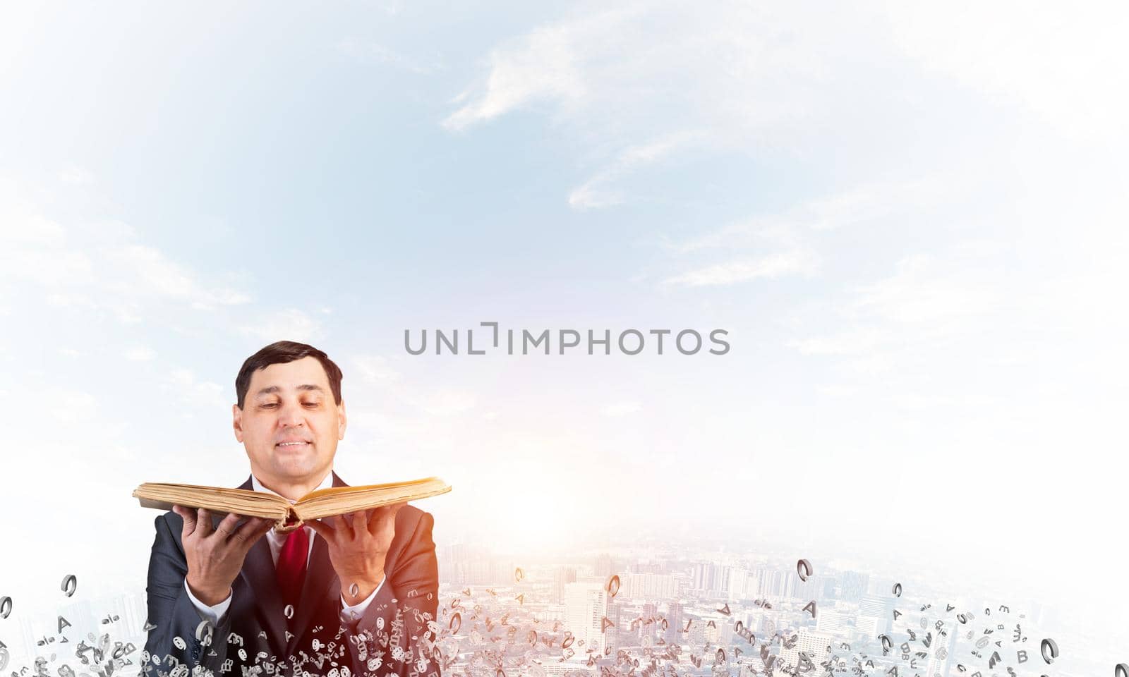 Happy businessman holding open old book. Smiling man in suit standing on city background with flying around various letters. Bookkeeper holding accountant book. Business accounting and consulting