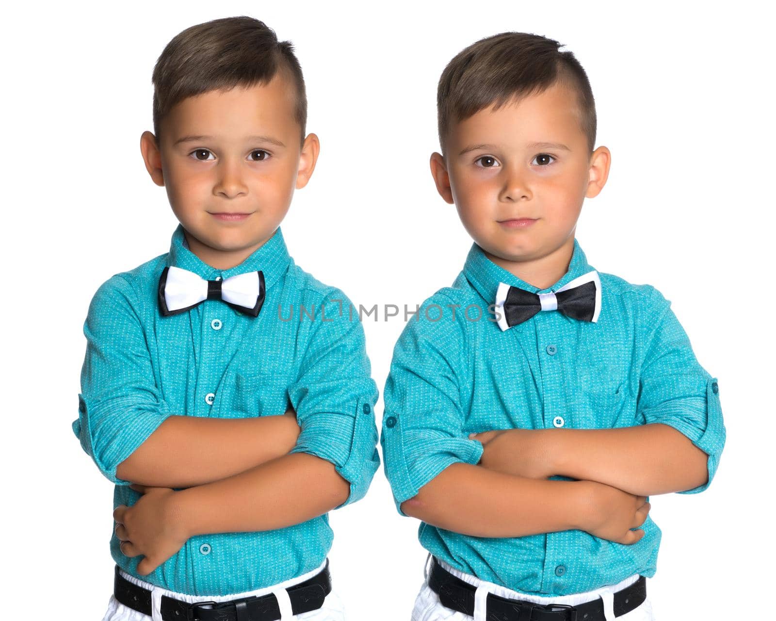 Two cute little boys, brothers close-up. The concept of a happy childhood, the development of a child in the family. Isolated on white background.
