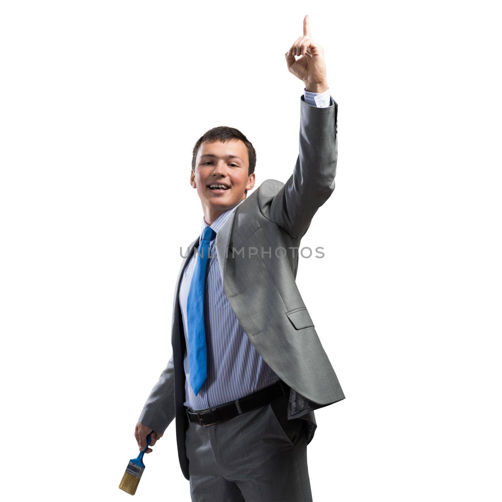 Confident and creative businessman painter finger pointing upwards. Portrait of happy handsome man in business suit and tie isolated on white background. Ambitions and creativity in business.