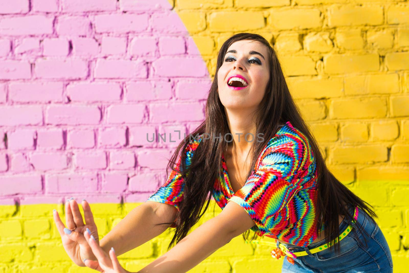 Street shaabi dance and urban dancer concept - Cheerful belly dancer dancing with arabic music on the street.