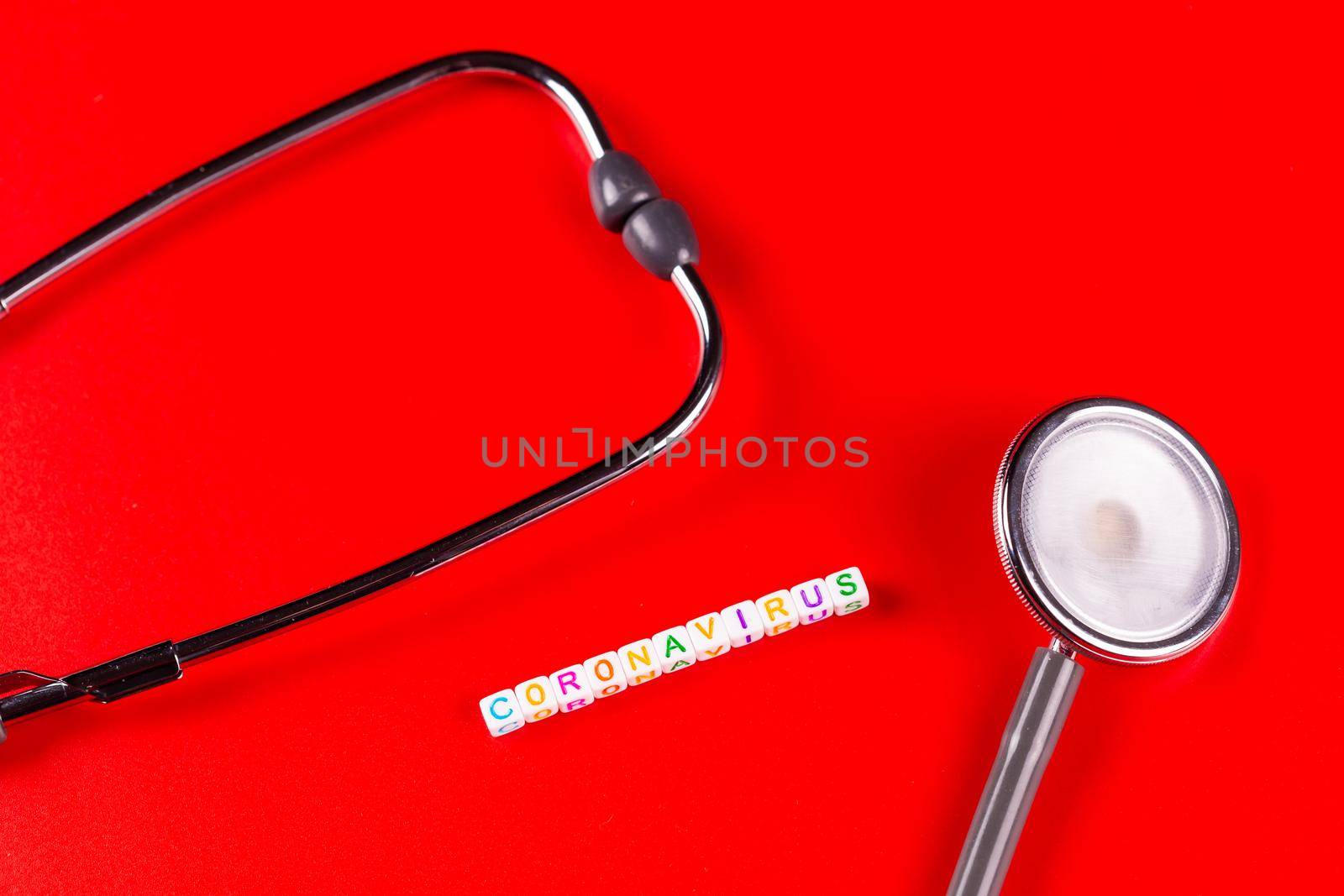 Pandemic and virus concept - Text phrase Coronavirus and syringe on red background. Novel coronavirus Covid-19