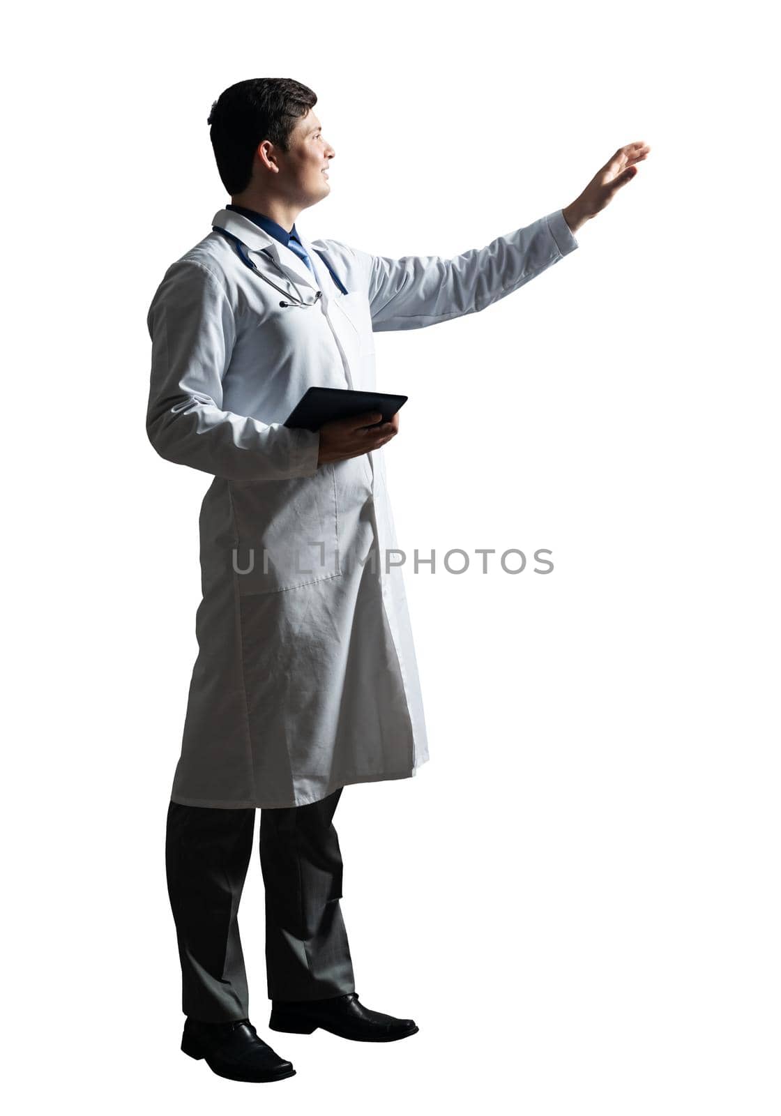 young doctor with a tablet computer, in a white medical coat and with a stethoscope