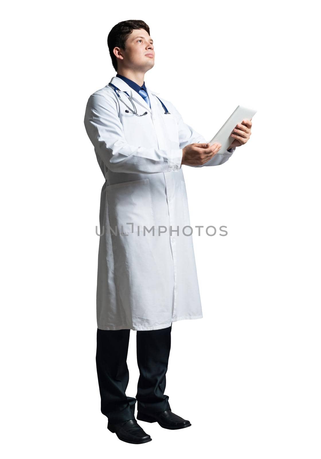 young doctor with a tablet computer, in a white medical coat and with a stethoscope