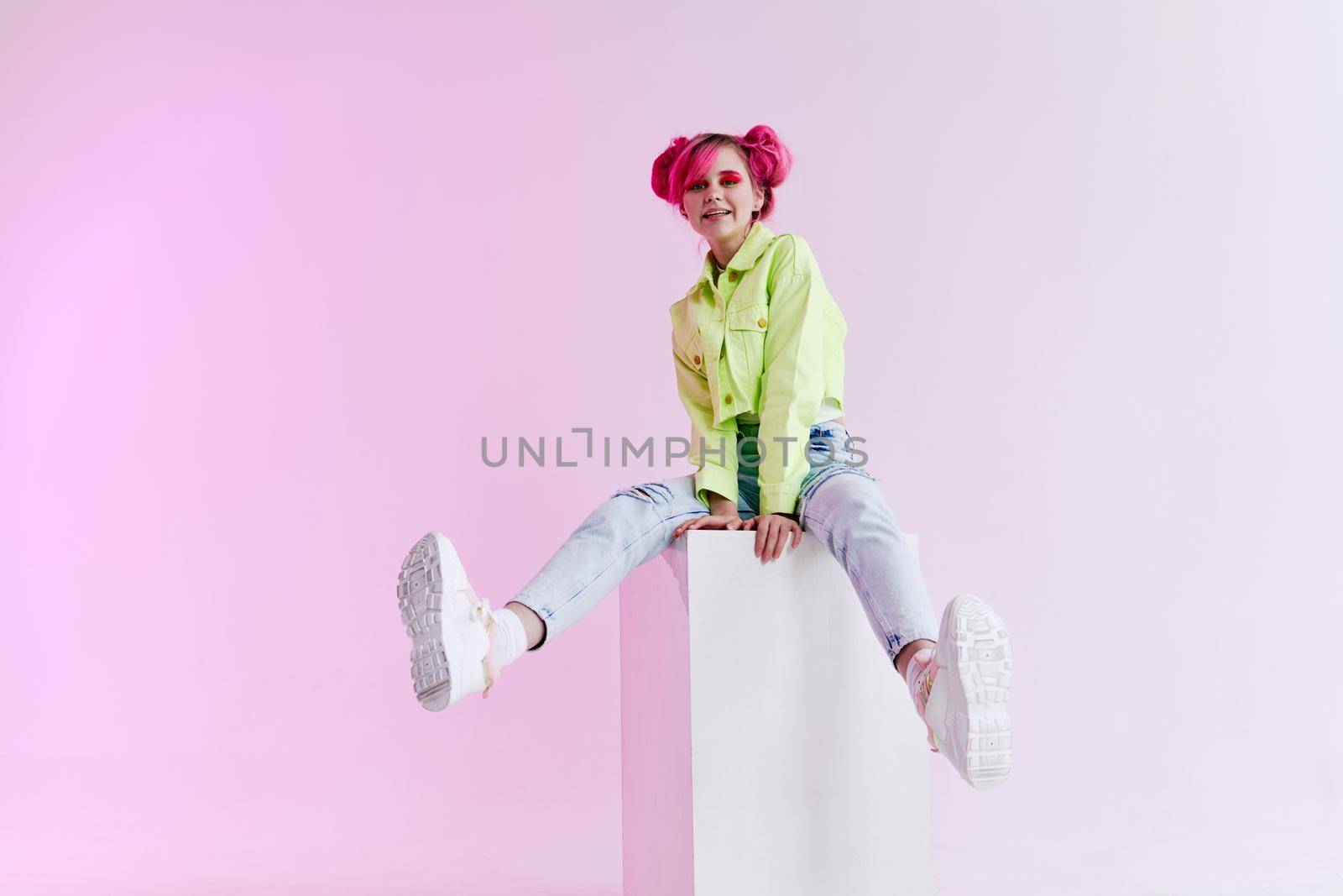 fashionable woman pink hair posing fashion clothes Acid style design. High quality photo