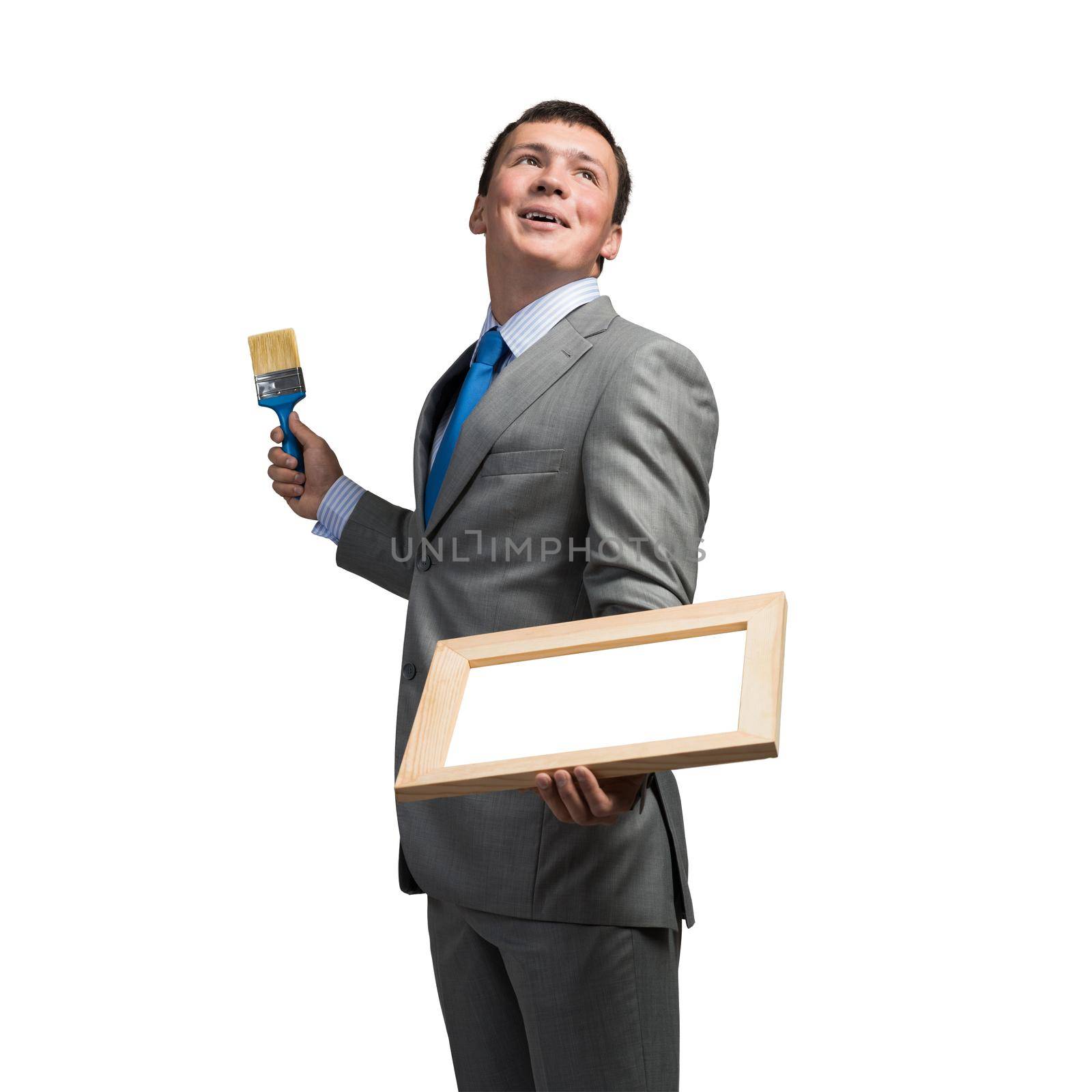 Creative businessman painter holding paintbrush by adam121