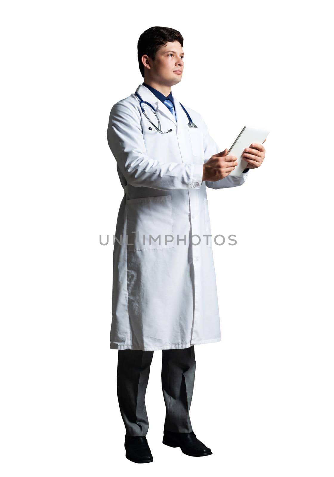 young doctor with a tablet computer, in a white medical coat and with a stethoscope