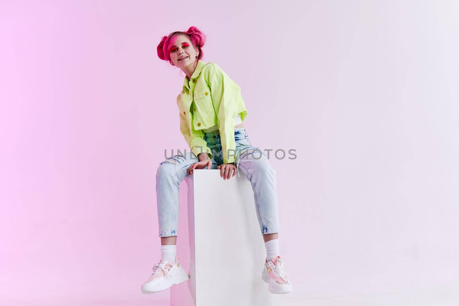 fashionable woman with pink hair creative studio model. High quality photo